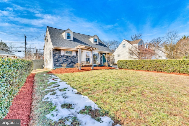 new england style home with a front yard