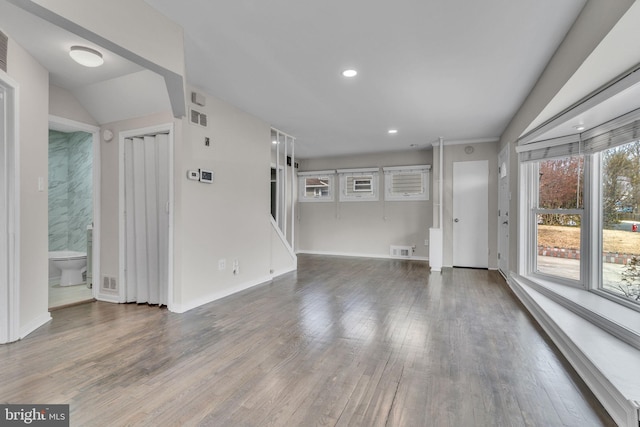 unfurnished living room featuring hardwood / wood-style floors