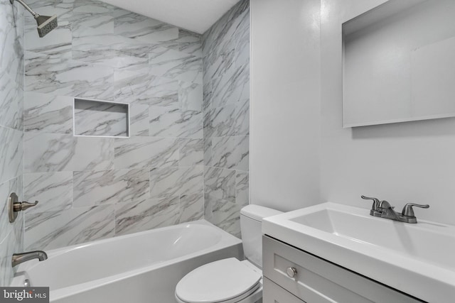 full bathroom featuring vanity, toilet, and tiled shower / bath