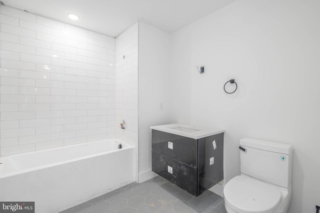 full bathroom with tile patterned floors, vanity, toilet, and tiled shower / bath