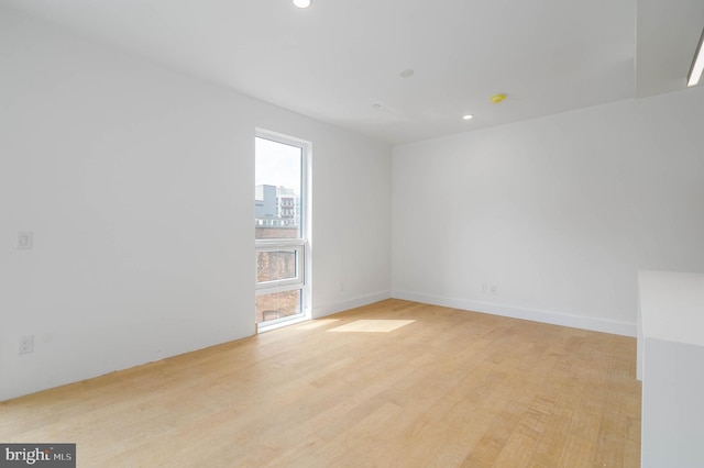 unfurnished room featuring light wood-type flooring