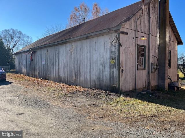 view of side of home with an outbuilding