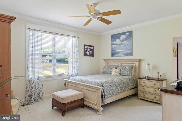 bedroom with crown molding, ceiling fan, and light carpet