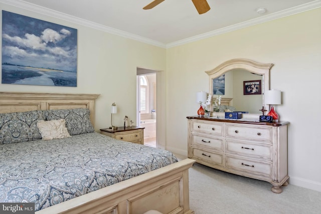 bedroom featuring crown molding, ceiling fan, ensuite bathroom, and light carpet