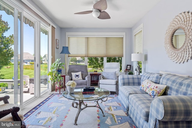 sunroom featuring ceiling fan