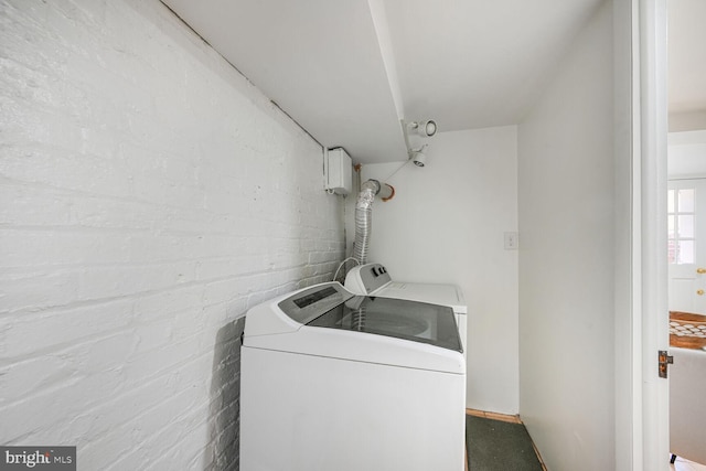 washroom featuring laundry area and separate washer and dryer