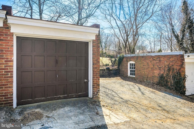 garage featuring driveway