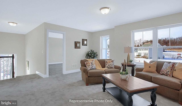 living room featuring light carpet