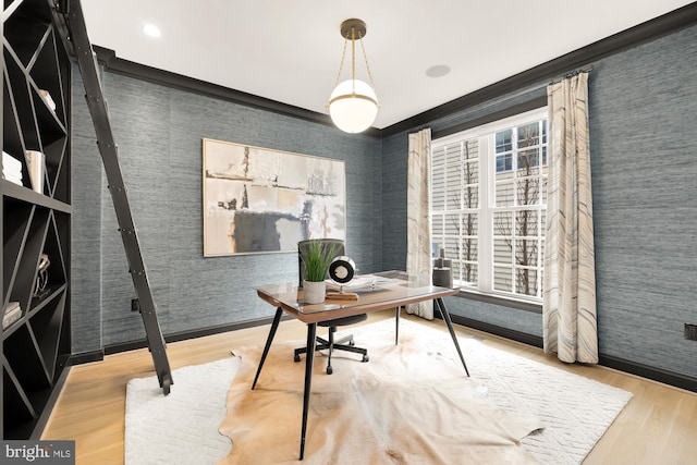 home office with wood-type flooring and crown molding