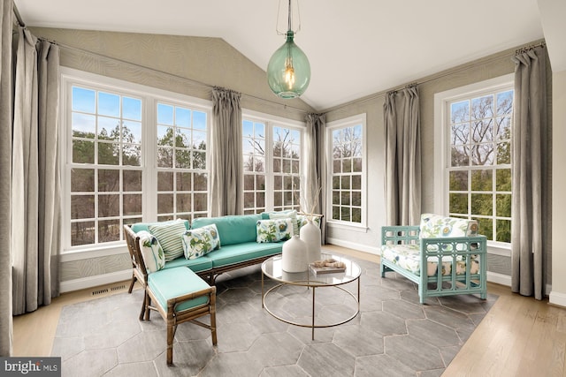 sunroom / solarium with lofted ceiling