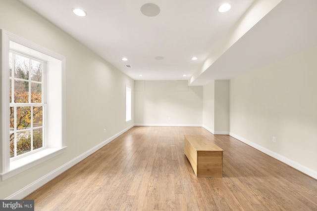 unfurnished room with light wood-type flooring