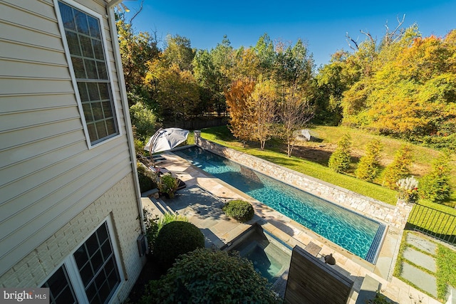 view of swimming pool featuring a patio