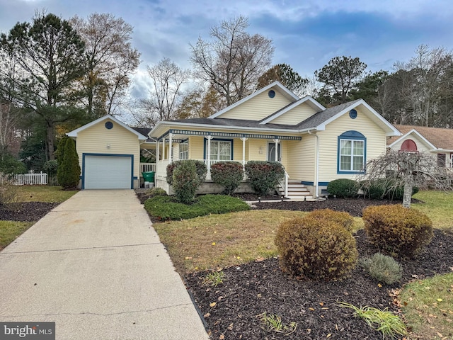 view of front of house with an outdoor structure, a porch, and a garage