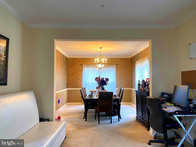 dining room featuring a notable chandelier, ornamental molding, and light carpet