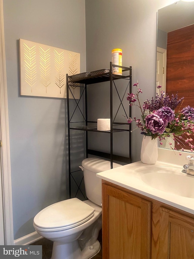 bathroom featuring vanity and toilet