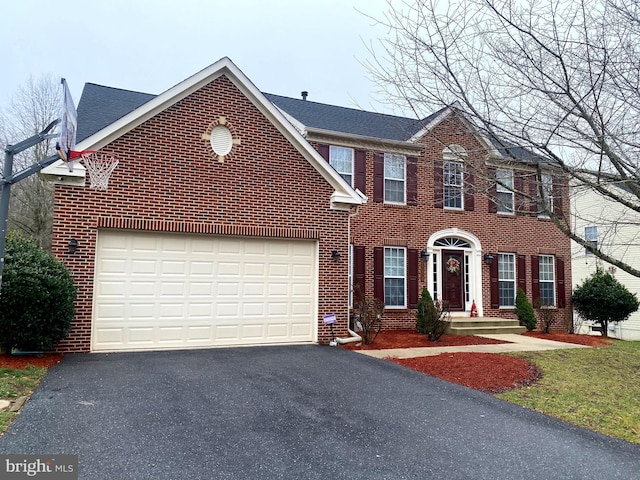 colonial inspired home featuring a garage