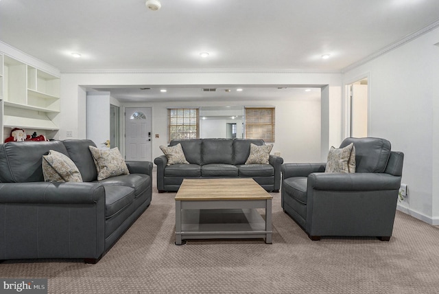 carpeted living room featuring crown molding