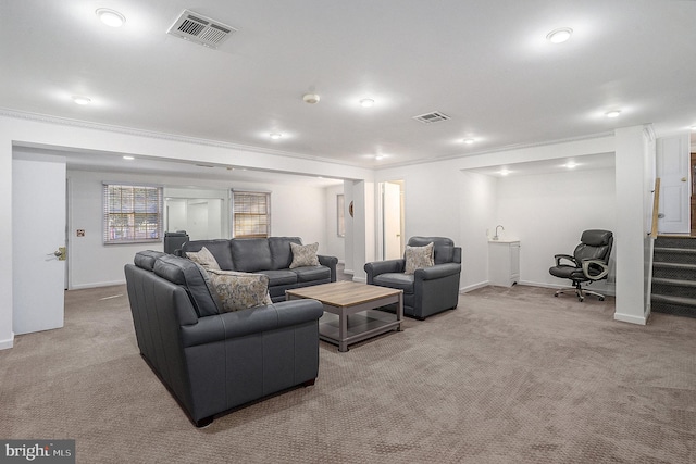 living room with light colored carpet and ornamental molding