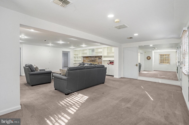 carpeted living room with built in shelves