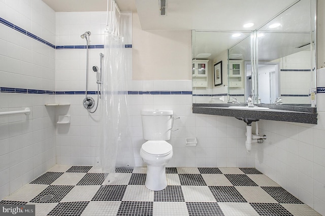 bathroom featuring toilet, tile walls, and curtained shower