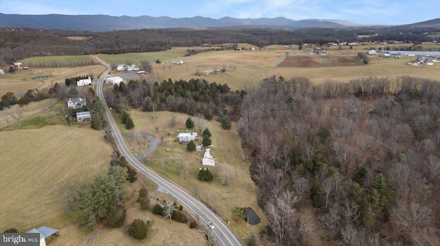 birds eye view of property with a mountain view and a rural view