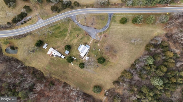 birds eye view of property with a rural view