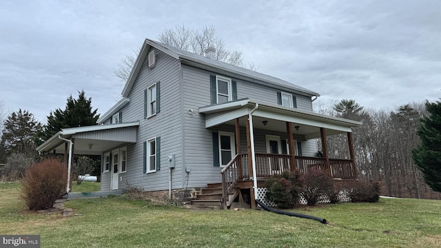 view of front facade featuring a front lawn and a porch