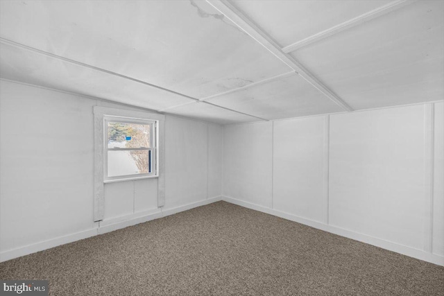 additional living space featuring carpet flooring