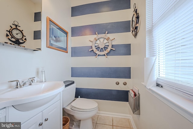 bathroom with tile patterned floors, vanity, and toilet