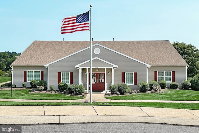 view of front of home featuring a front yard and a porch