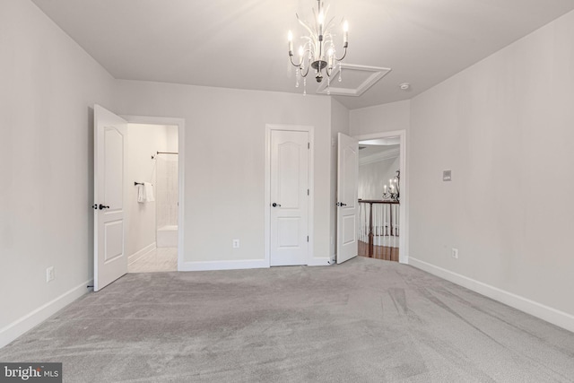 unfurnished bedroom featuring carpet and a chandelier