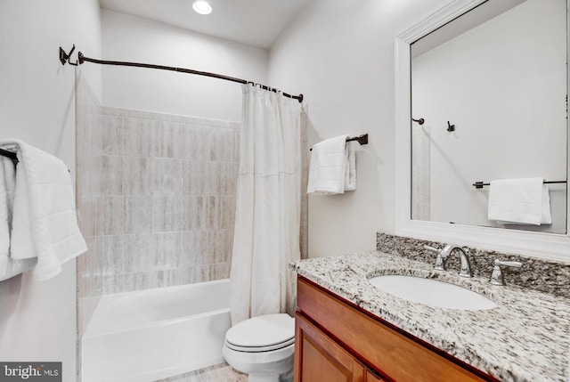 full bathroom with shower / tub combo, vanity, and toilet