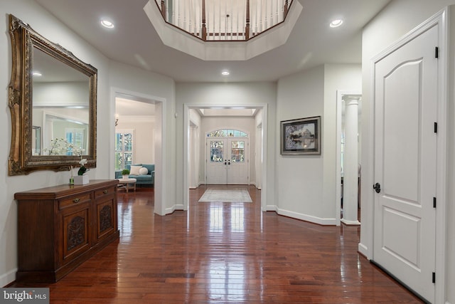 hall with french doors and dark wood-type flooring