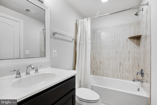 full bathroom with shower / bath combo, toilet, and vanity