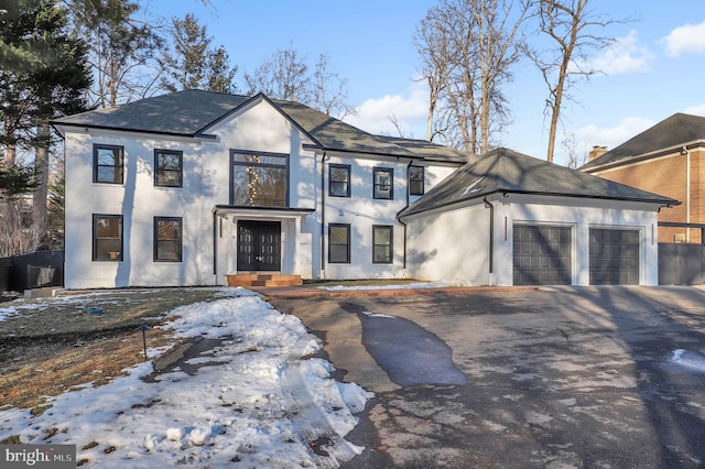 view of front facade featuring french doors and a garage