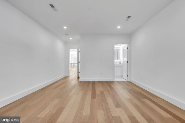 unfurnished room featuring light hardwood / wood-style flooring