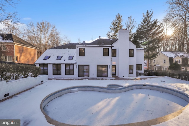 view of snow covered pool