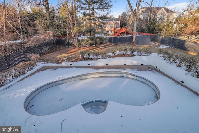 view of snow covered pool