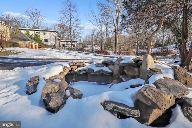 view of snow covered pool