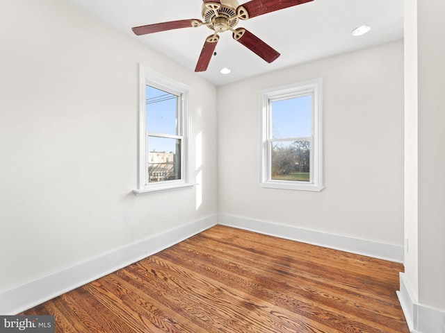 spare room featuring ceiling fan and wood-type flooring