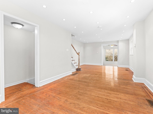 spare room featuring light wood-type flooring and ceiling fan