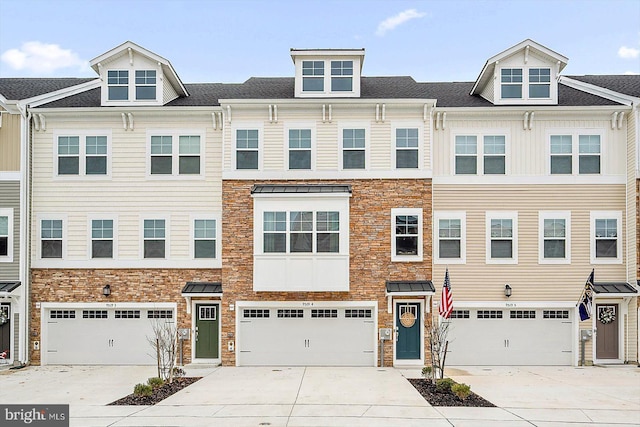 townhome / multi-family property featuring a garage