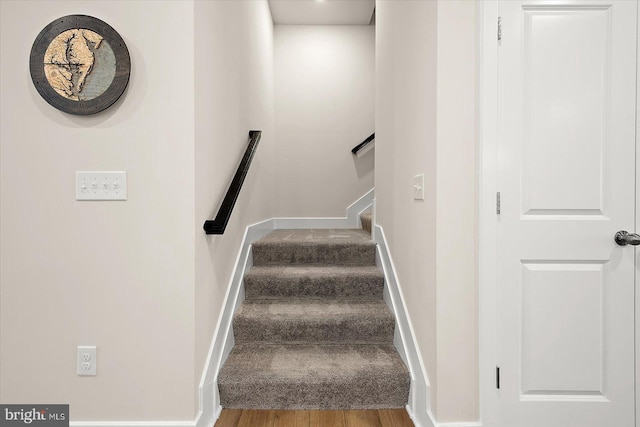 stairway with wood-type flooring