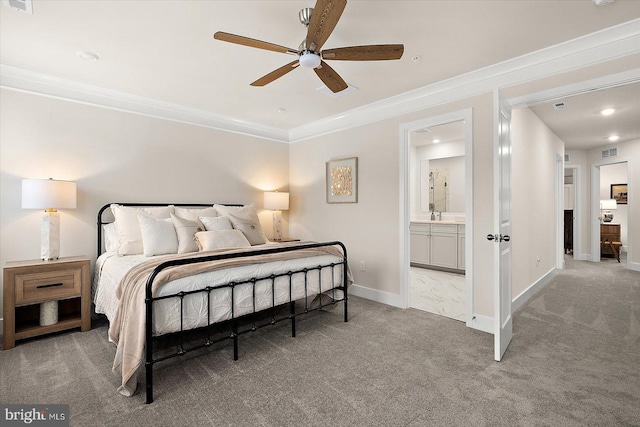 bedroom with carpet flooring, connected bathroom, ceiling fan, and crown molding