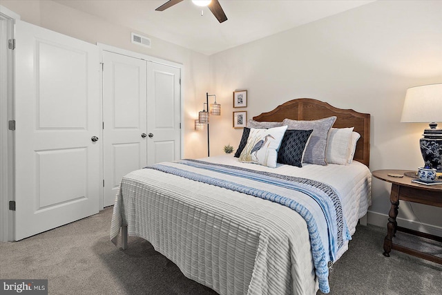 carpeted bedroom featuring ceiling fan and a closet