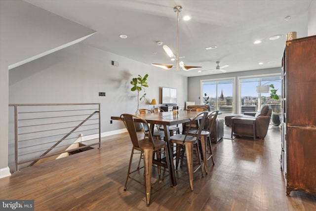 dining area featuring ceiling fan and dark hardwood / wood-style flooring