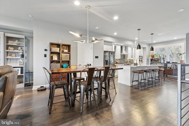 dining area with dark hardwood / wood-style floors