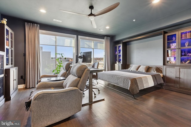 bedroom featuring ceiling fan and dark wood-type flooring