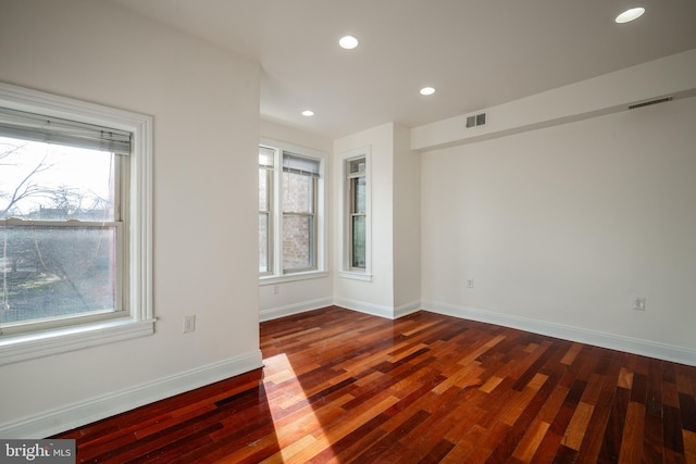 empty room with dark hardwood / wood-style floors