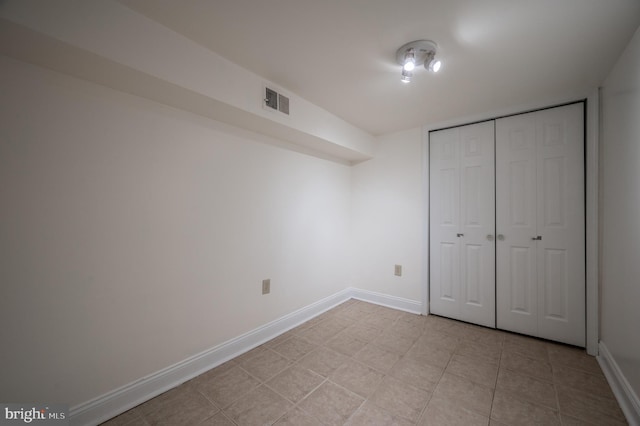 unfurnished bedroom with a closet